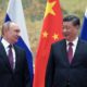 In a call last week, Chinese President Xi Jinping (R) assured his Russian counterpart Vladimir Putin (L)that China would support Russia on 'sovereignty and security'
