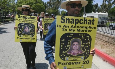 Protesters march in front of Snapchat headquarters in Santa Monica, California on June 13, 2022 demanding social media companies to block the sale of drugs on their platforms