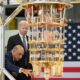 US President Joe Biden listens to IBM CEO Arvind Krishna as he tours the IBM facility in Poughkeepsie, New York