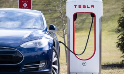 A Tesla Model S sedan is plugged into a charging station in Falls Church, Virginia