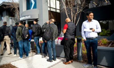 Silicon Valley Bank customers wait in line at SVB’s headquarters in Santa Clara, California on March 13, 2023