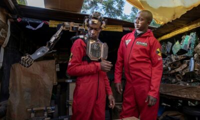 David Gathu, left, and Moses Kiuna are self-taught Kenyan innovators who have built a bio-robotic prosthetic arm out of electronic scrap